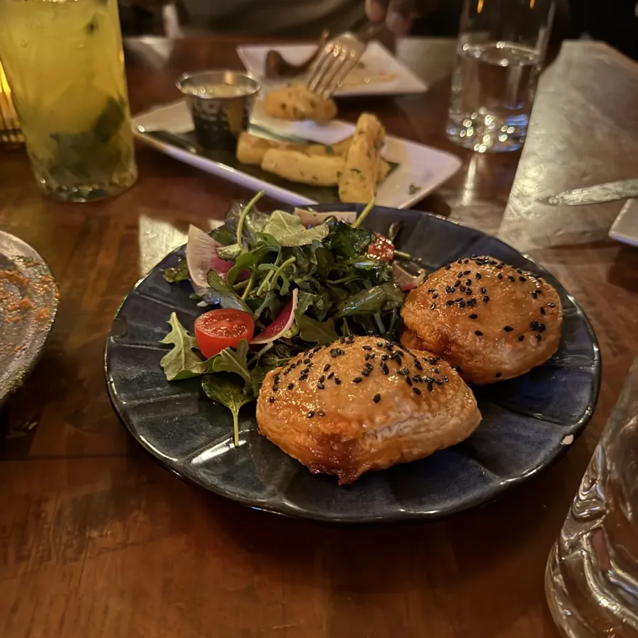 pastries and a mint drink on a dinner table